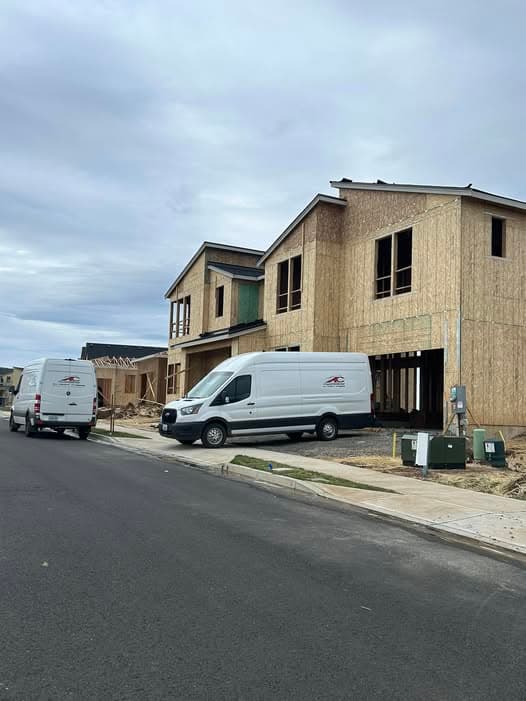 All County Plumbing fleet at a new construction project