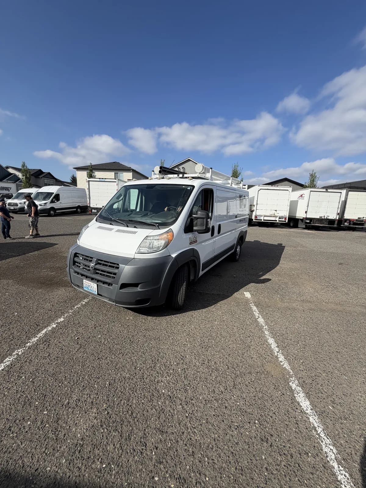 All County service van parked in the lot behind the shop