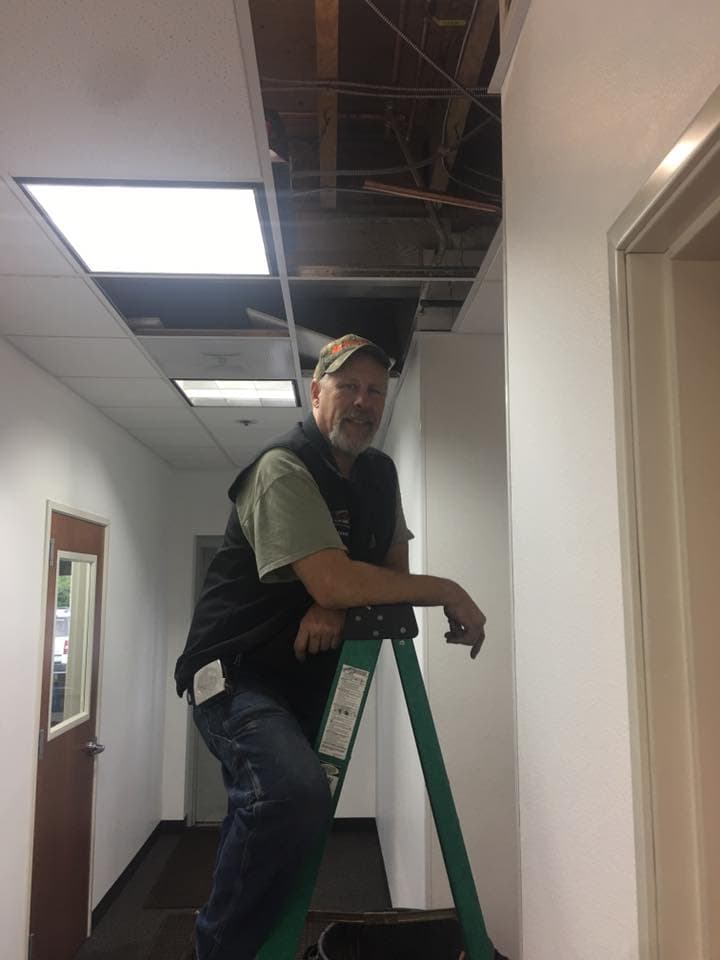 All County plumber working in a commercial space