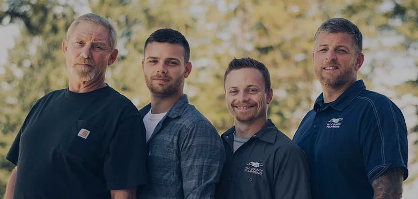 The Veach family and All County Plumbing team