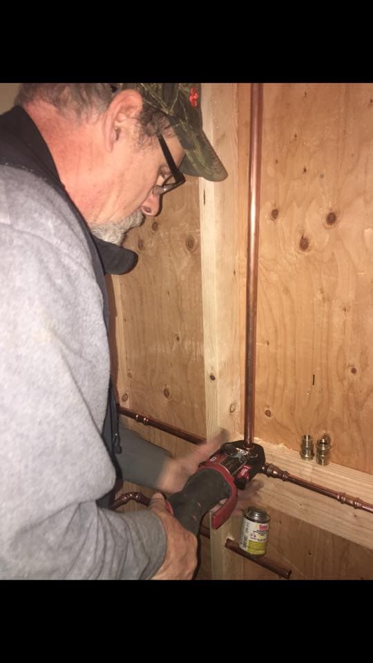 All County plumber working on copper pipe